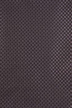 Close up of black textured material used in suits