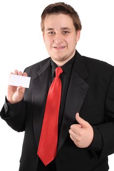 Businessman holding a blank business card in one hand and making a thumbs uup with the other on a white background (focus on card)