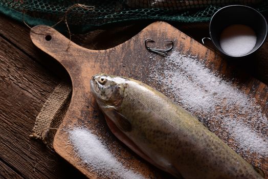 Fresh trouts on wooden background