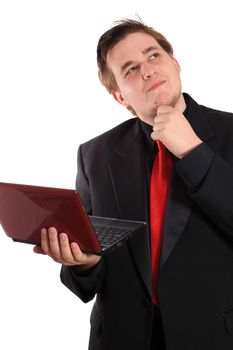 Handsome young businessman holding small computer laptop with a wondering expression on white background