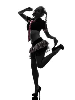 one caucasian sexy woman schoolgirl costume portrait in silhouette studio isolated on white background