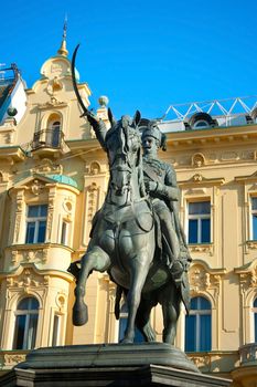ZAGREB, CROATIA - AUGUST 21, 2013: Ban Jelacic monument on central city square of  Zagreb. The oldest standing building here was built in 1827