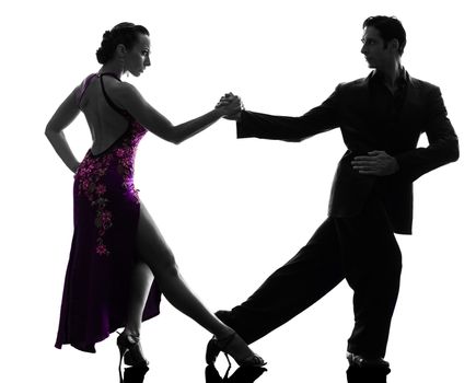 one caucasian couple man woman ballroom dancers tangoing in silhouette studio isolated on white background