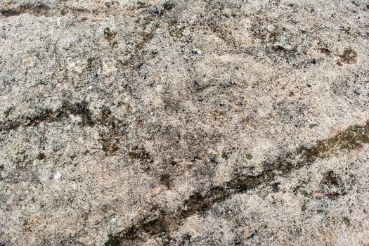 A natural wall of rough stone