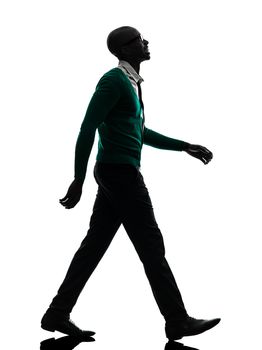 one african black man walking looking up smiling in silhouette studio on white background