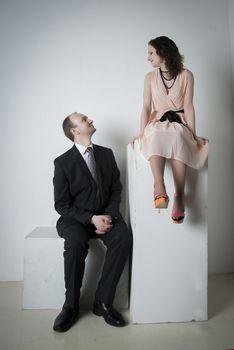 young man and woman look at each other in the Studio