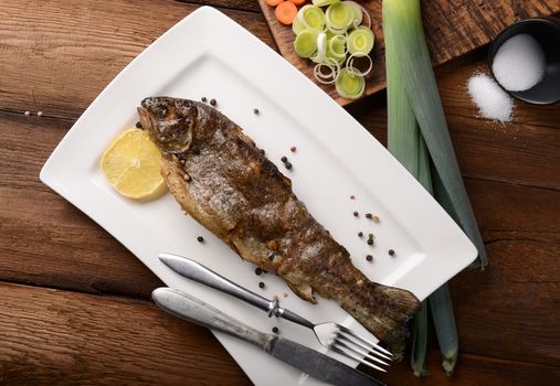 Fresh trout on wooden background