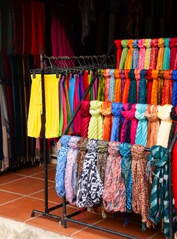 Colorful silk clothing at a market stall in Vietnam