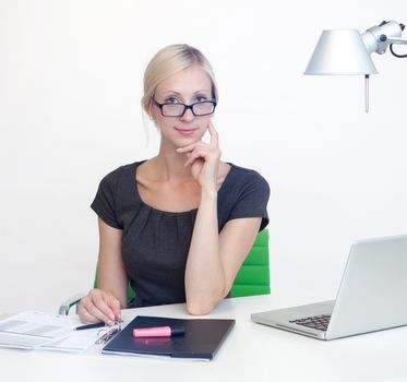 Young Business woman is smiling while working at work desk