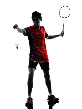 one asian badminton player young man at service in silhouette isolated white background