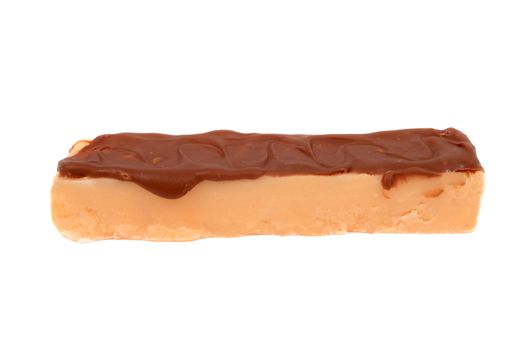 Delicious, sweet orange fudge drizzled with chocolate on a white background