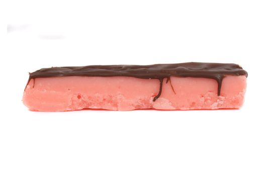 Strawberry pink fudge bar covered in chocolate on a white background