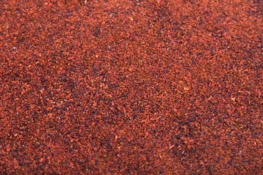 Close up of vibrant rusty color chili powder spice