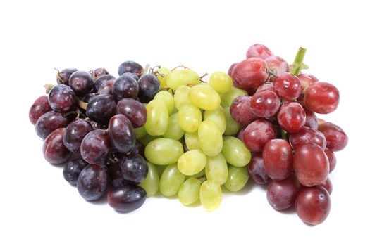 Three different types of grapes in red, green and black on white background