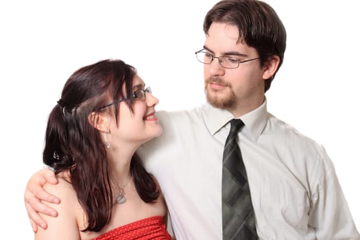 Cute young couple posing together on a white background