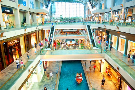 SINGAPORE - MARCH 08, 2013 : Shopping mall at Marina Bay Sands Resort in Singapore. It is billed as the world's most expensive standalone casino property at S$8 billion