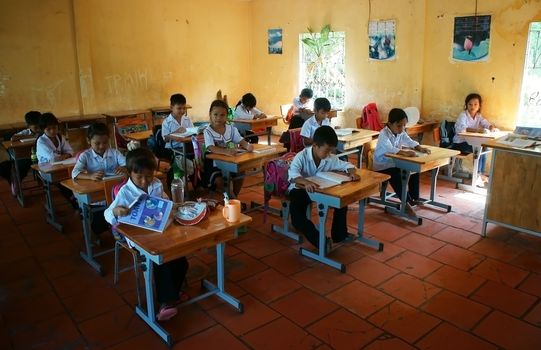 LONG AN, VIET NAM- NOV 11: Primary pupil in school time of primary school in Long An, VietNam on Nov 11, 2013