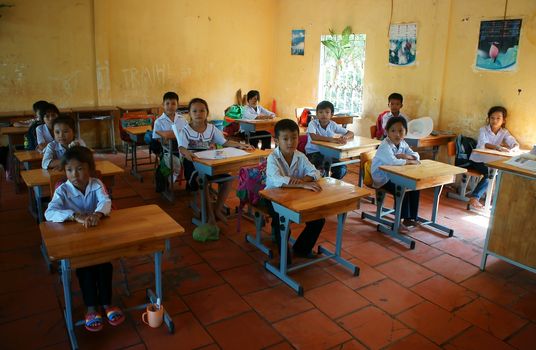 LONG AN, VIET NAM- NOV 11: Primary pupil listening with concentration in classroom of primary school in Long An, VietNam on Nov 11, 2013