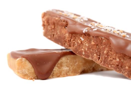 Close up of fudge bar pile in different colors and flavors covered in chocolate