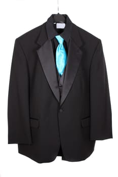 Black dressy formal three piece  suit with shirt, vest  and blue tie