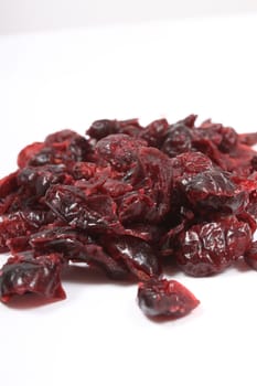 Healthy dried cranberries on a white background