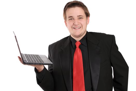 Handsome, smiling young businessman holding small netbook computer on white background