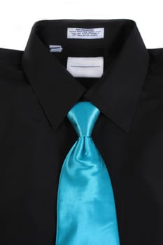 Black dressy business shirt and formal blue tie on a white background