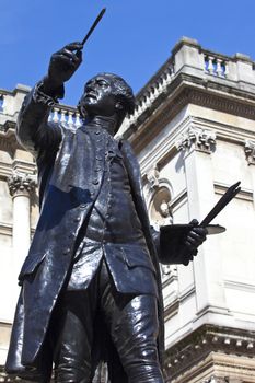 Statue of English painter Joshua Reynolds situated at Burlington House which houses the Royal Academy of Art in London.