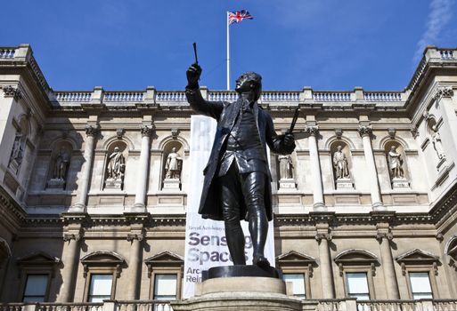 Statue of English painter Joshua Reynolds situated at Burlington House which houses the Royal Academy of Art in London.