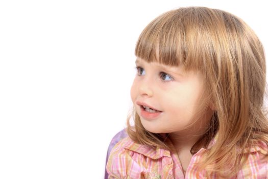 Little two year old girl looks to the side on a white background