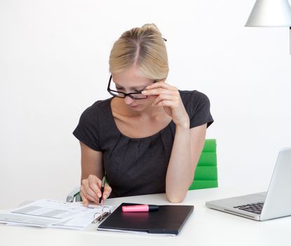 Young Business woman is smiling while working at work desk