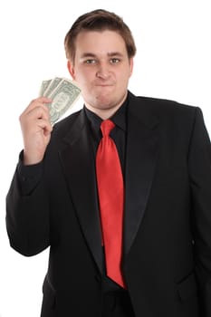 Attractive young man in black suit holding one dollar bills on a white background