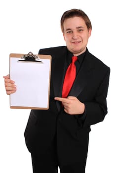 Businessman pointing at and holding a clipboard with a blank page on a white background