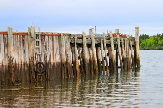 Wooden pier along the Bay of Fundy in Maces Bay, New Brunswick, Canada