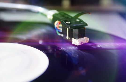 a blurry background with turntable and light effects