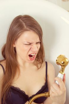 Portrait of a young  woman having fun in shower