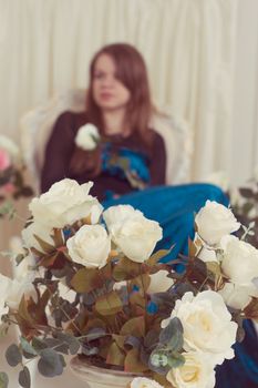 attractive girl in a beautiful white chair