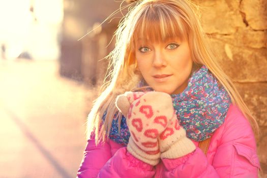 Attractive young blonde woman freezing in the winter