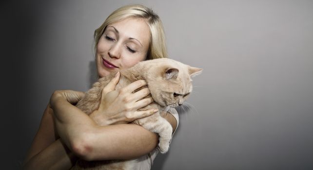 Young Woman loves her cute Cat