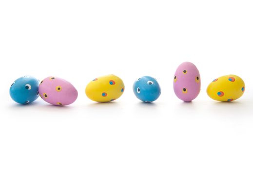 Closeup of painted easter eggs on a white background
