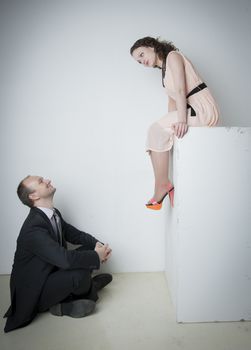 young man and woman look at each other in the Studio