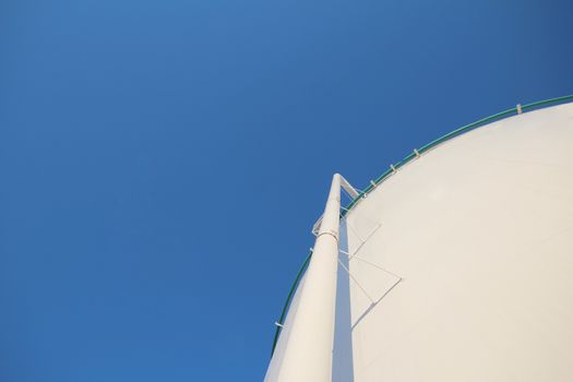 Oil storage tank and blue sky at refinery