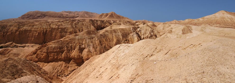 Mountains and canyon in stone desert