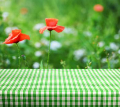 Empty table and green background