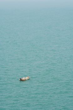 Fishmen on small boat in the sea