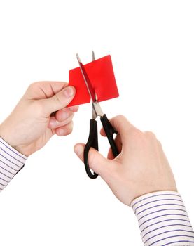 Person cutting a Credit Card Closeup Isolated on the White Background