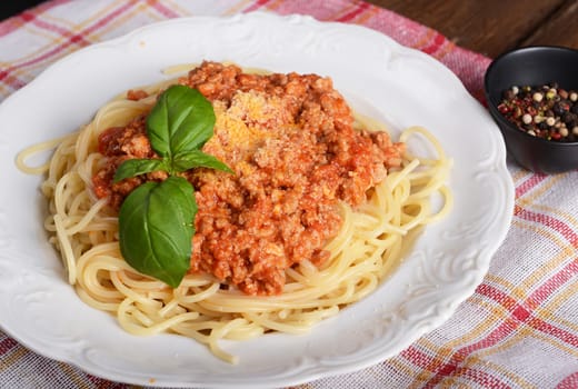 Tasty spaghetti with cheese and basil