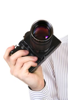 Old Camera in a Hand Isolated on the White Background