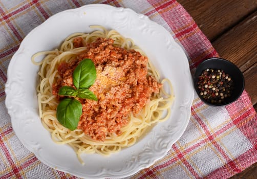 Tasty spaghetti with cheese and basil