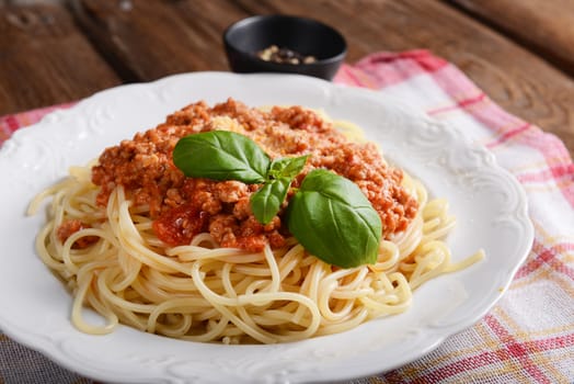 Tasty spaghetti with cheese and basil